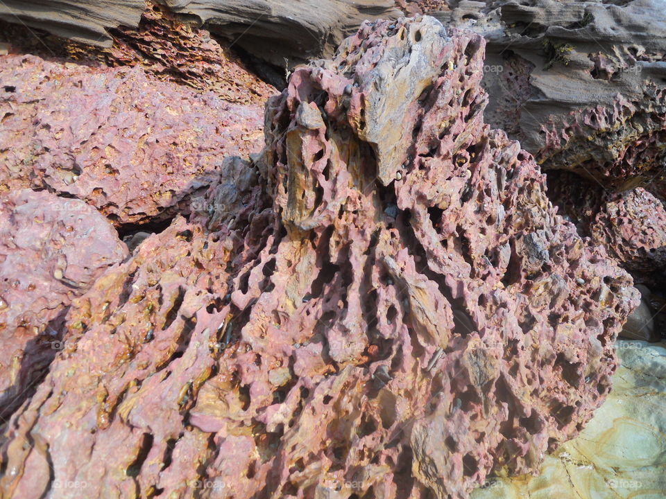 View of weathered rock on beach