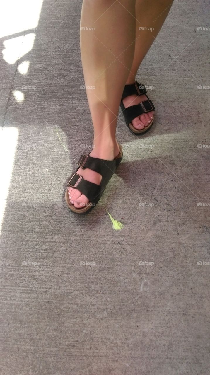 Feet stepping in gum