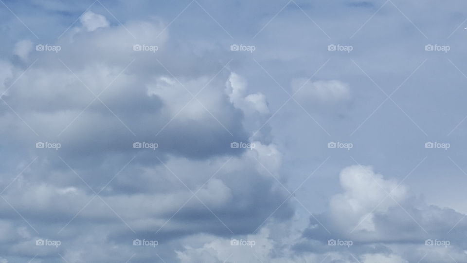 Clouds race across a stormy sky.