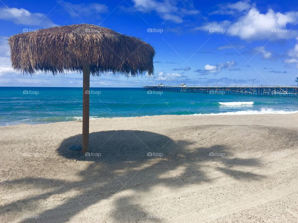 Foap Mission Summertime! Palapa On The Beach With A Pier in The Background ☀️