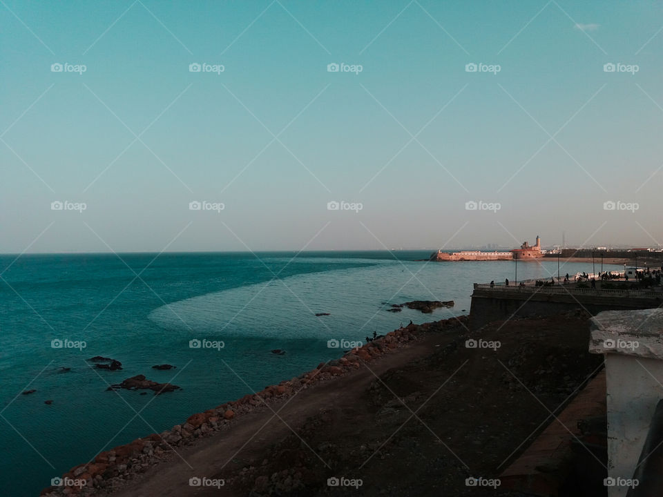 a picture of Algiers blue sea with lighthouse