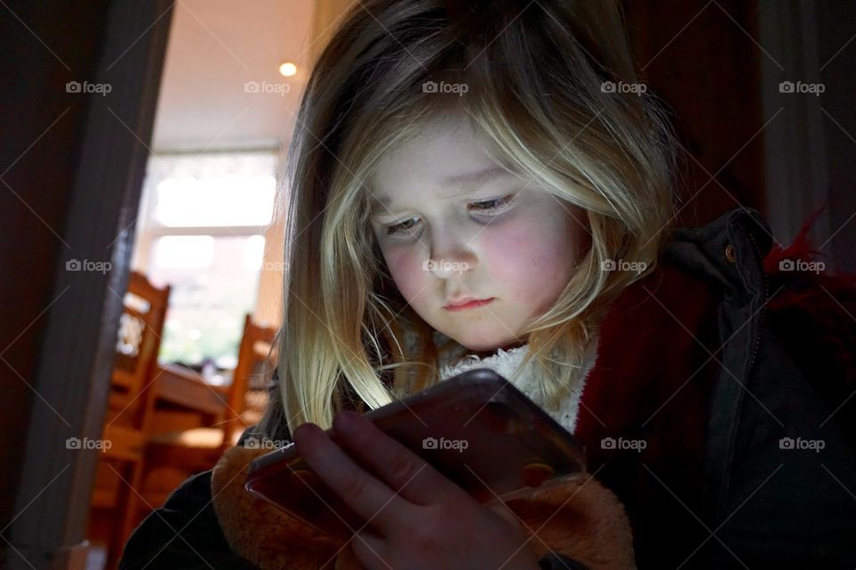 Girl watching on a Smartphone
