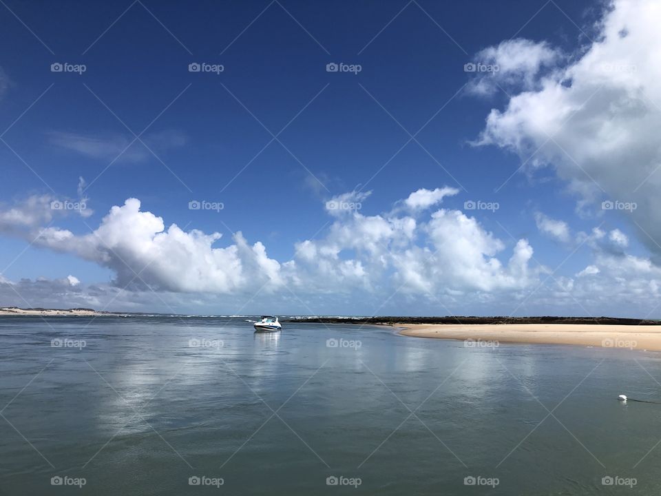 Boat on the ocean and the beach