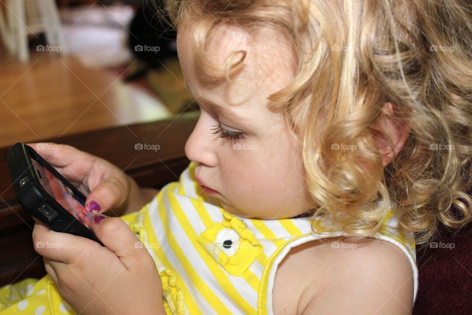 Close-up of girl using mobile phone