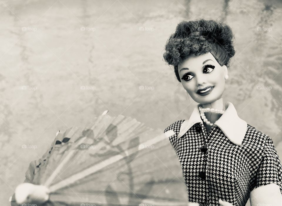 Staying dry with an umbrella and an I Love Lucy Barbie 