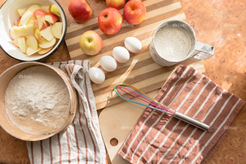 Making homemade puffed apple pie with eggs, sugar and flour.
