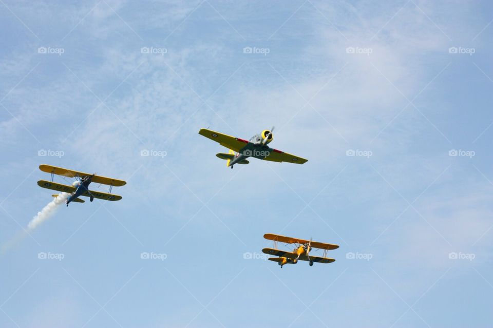 Three colorful airplanes approaching