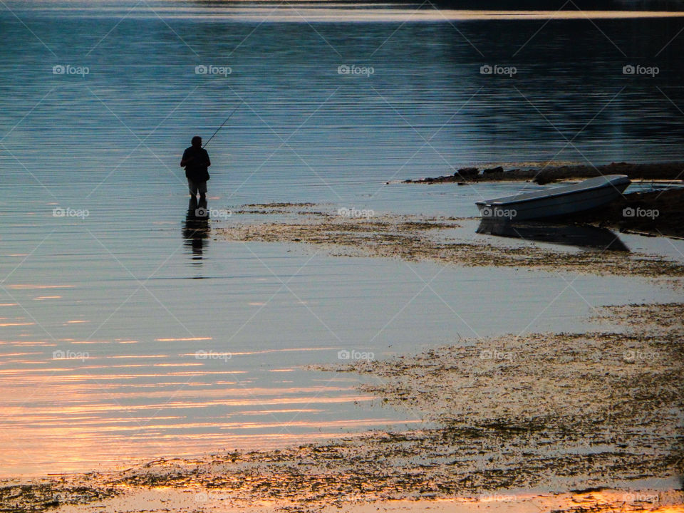Fisherman in Lake Maggiore in Italy