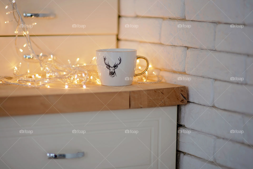 cup of coffee in a cozy festive Christmas atmosphere