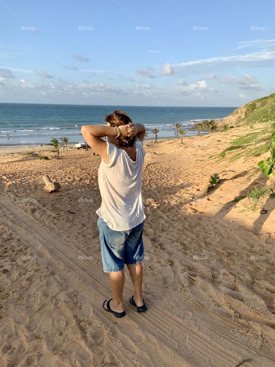Woman in meditation on waterfront 