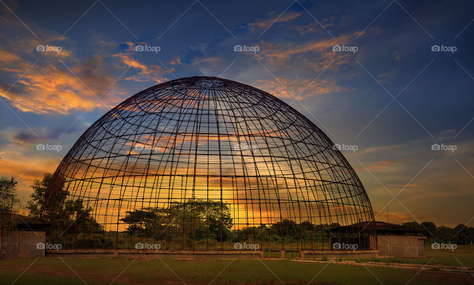 bird cage with sunset background