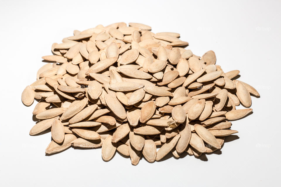 Tasty Pumpkin Seeds Isolated In White Background

