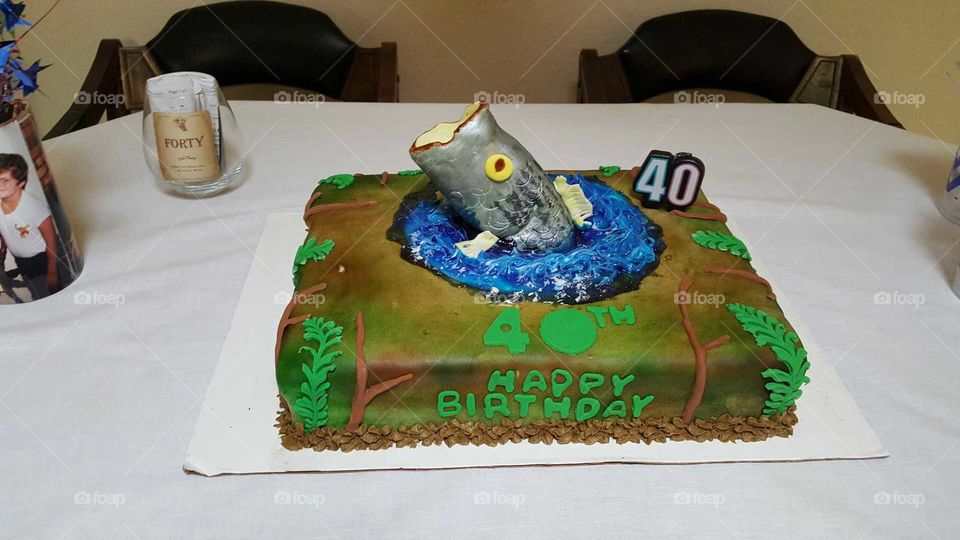 This is what a cake looks like when you have it made for your brothers birthday and he's a fisherman! Yikes! Pretty ugly