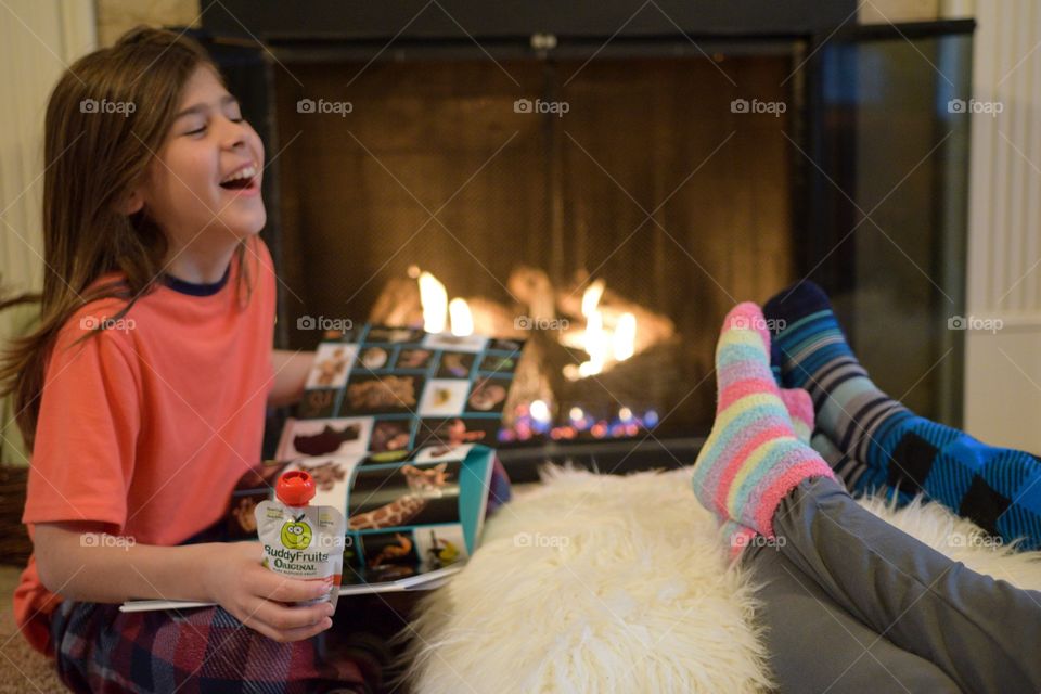 Laughing and Reading a Book in front of the Fire with Buddy Fruits 