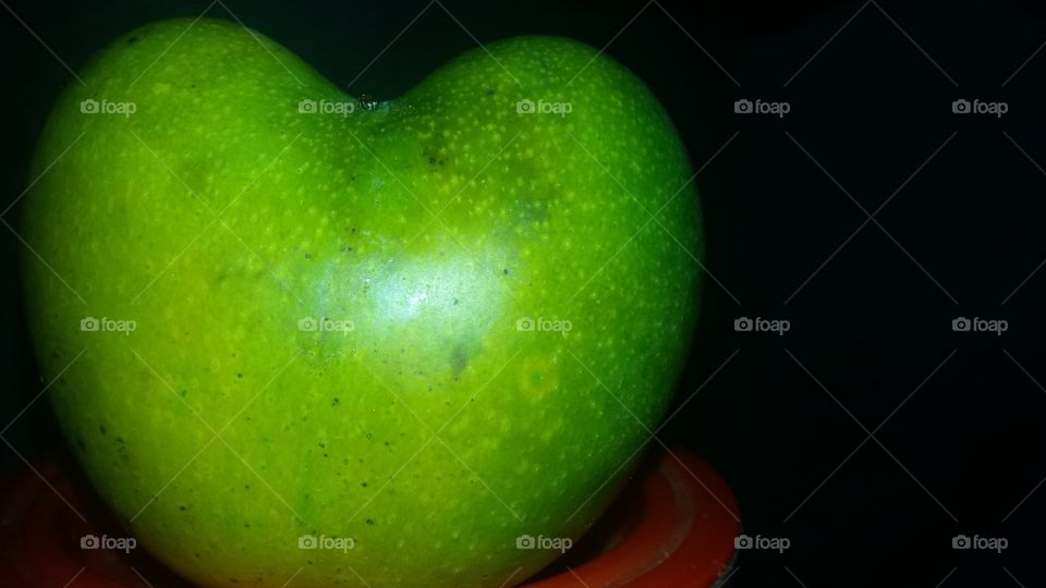 heart shape mango which is not fake it is real . Herat shape mango