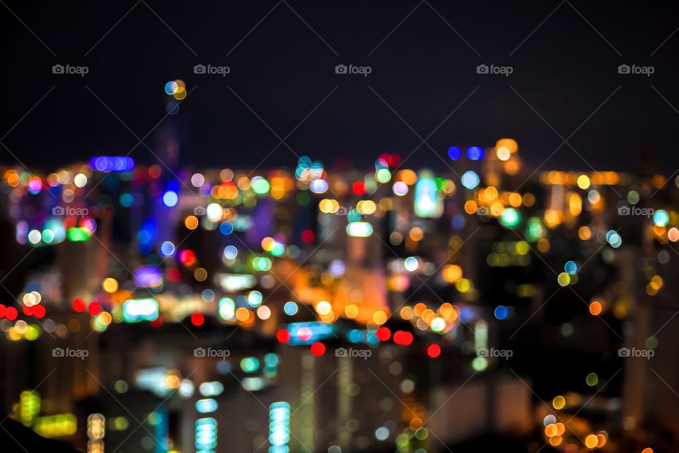 Defocused illuminated street lights at night