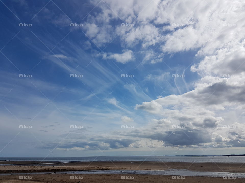 Beautiful sky over a beach in St Andrews Scotland