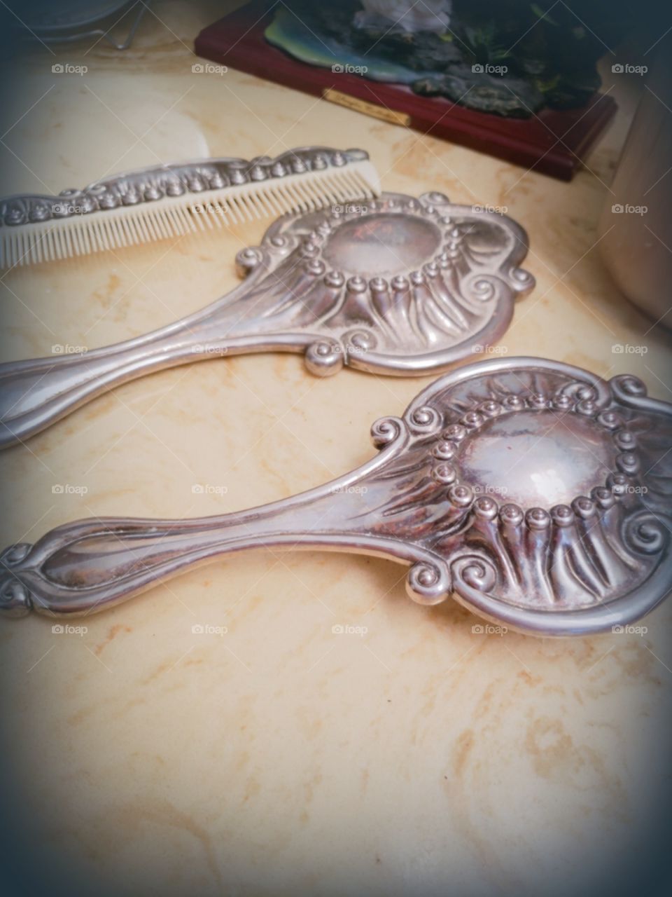 A beautiful silver antique set my grandmother owns. A soft bristle brush, comb and mirror.