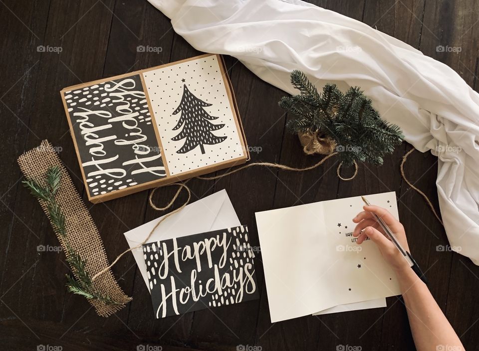 Writing holiday cards at home 