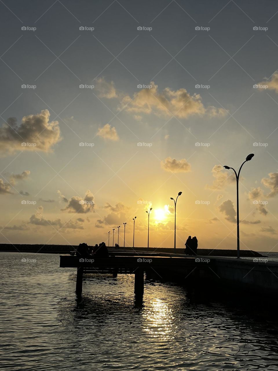 Sunset at Kulhudhufushi: Kulhudhufushi island is in the North of Maldives. Kulhudhufushi Islanders usually go to the beach to enjoy the sunset to mark the end of the daily work.