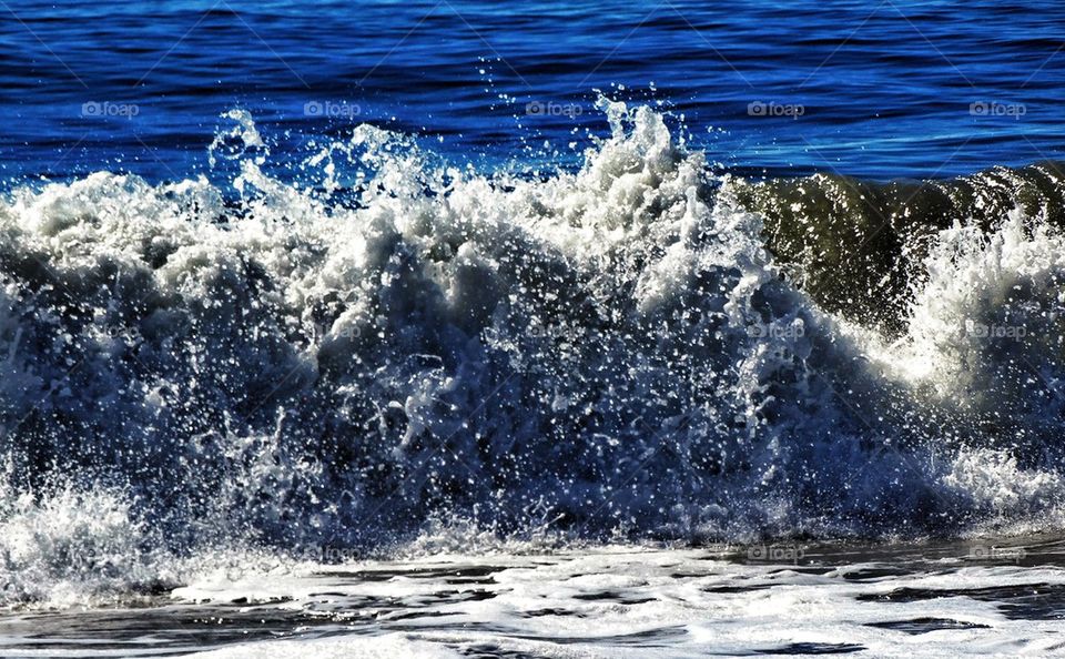 Ocean waves crashing with spray