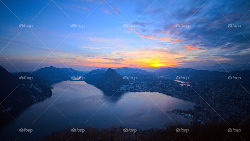 Panorama of Lake Lugano at sunset seen from the mountain