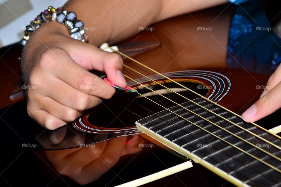 Young female guitar player