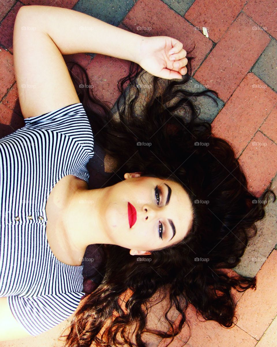 Beautiful woman lying on floor