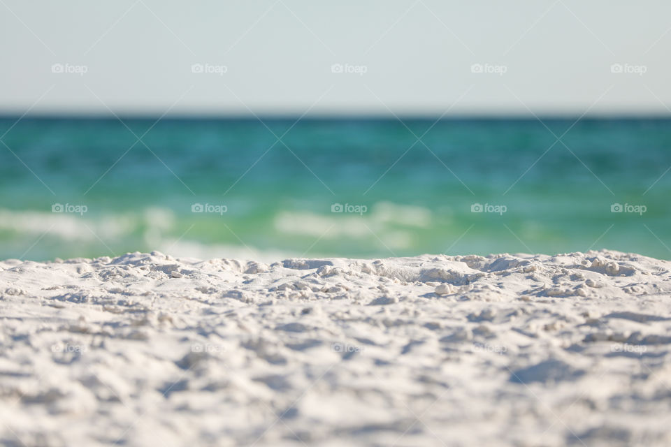 Sugar white sand beach on hot summer day in Florida with ocean at the background