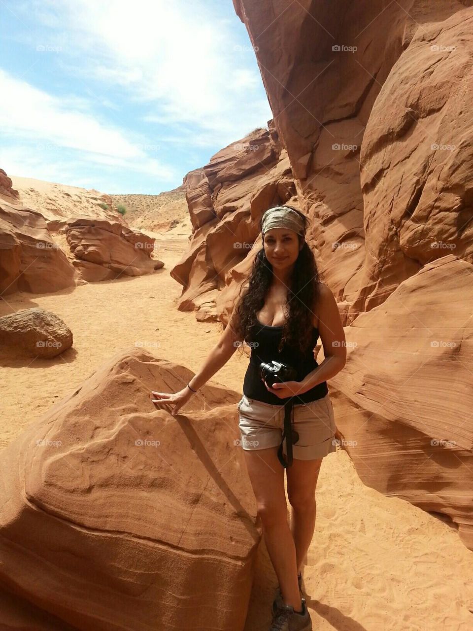 Woman hiking in a canyon.