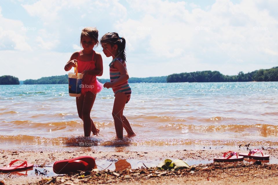 Two girls playing at beach