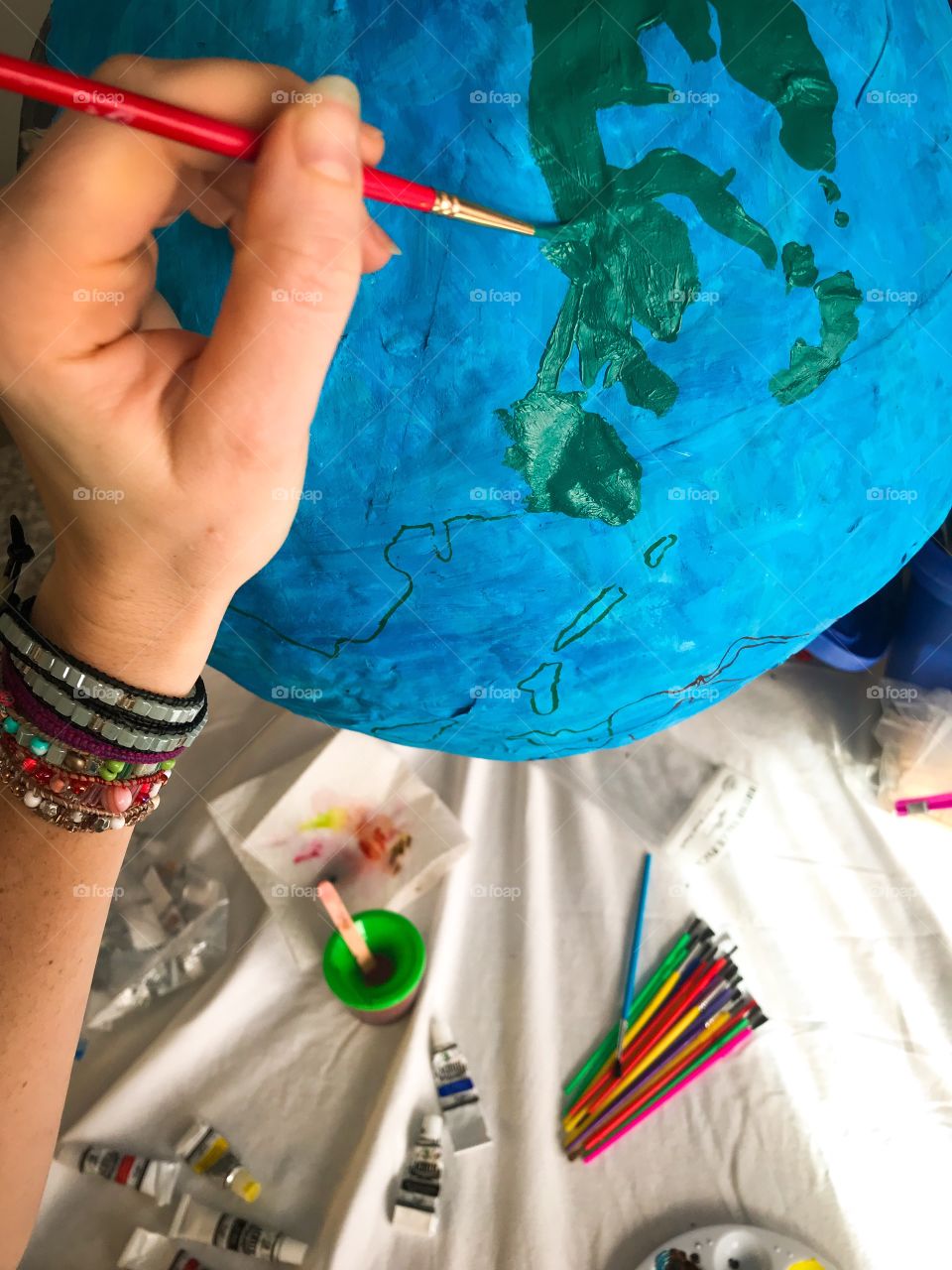 Homeschool homemade paper maché globe painting colorful continents