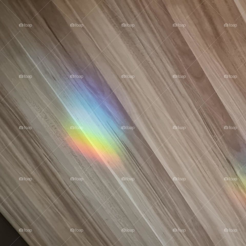 Rainbow from "glass prism" in glass panel