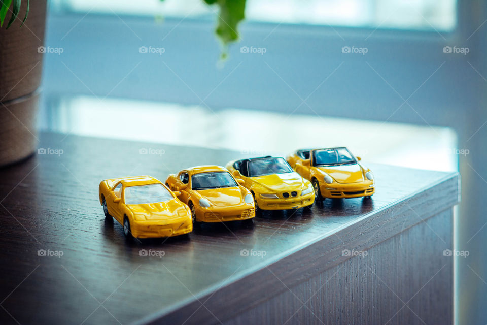 Toy cars staying on a table