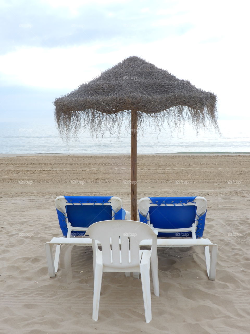 Sunbeds and umbrella on the Beach