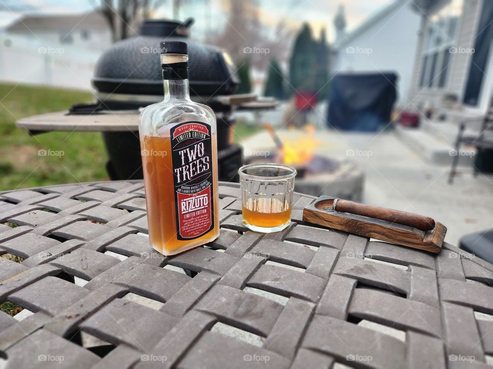 Whiskey and a cigar while grilling
