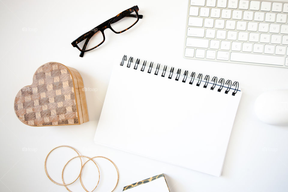 Blank notepad flatlay with office items