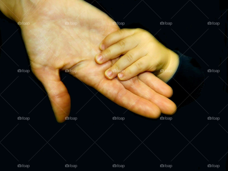 Child's Hand Holding On To Mom's Hand