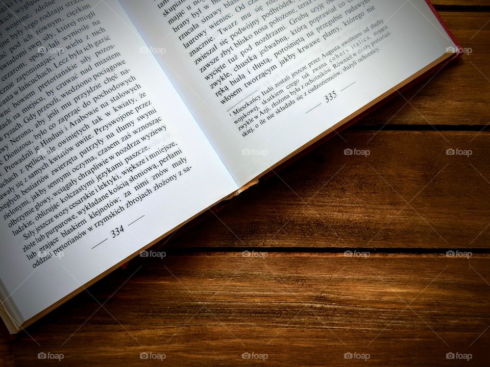 An open book on a wooden background