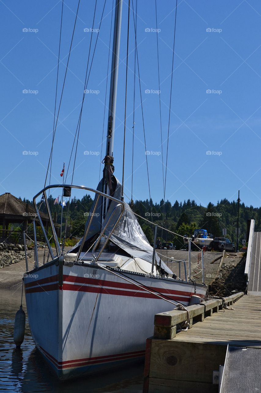 Sailboat moored at dock. Sailboat moored at dock