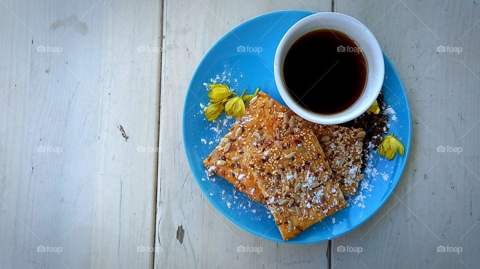 a cup of coffee on the plate