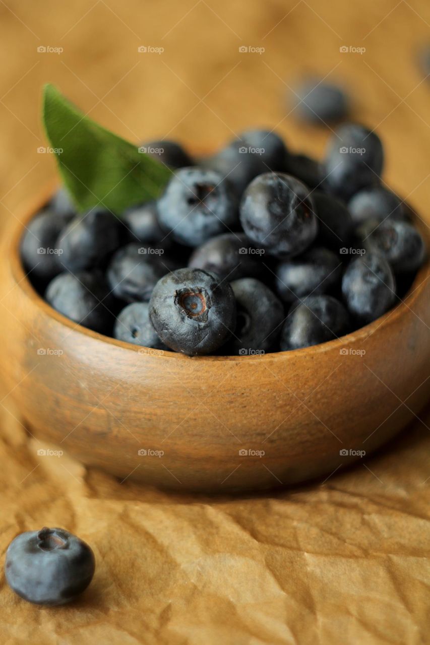 Blueberries in a wooden bowl