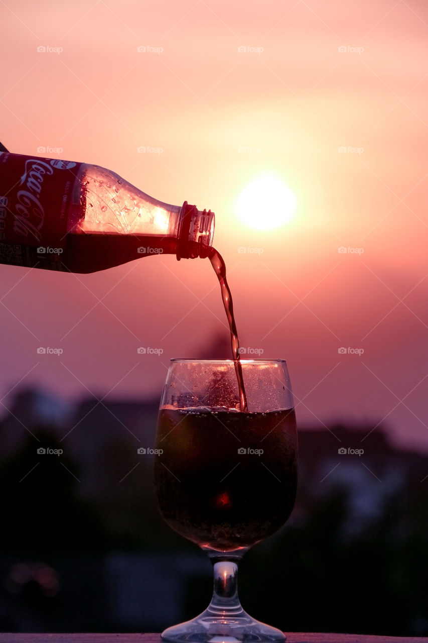 let's enjoy this beautiful summer sunset with a glass of fresh cola from your roof top