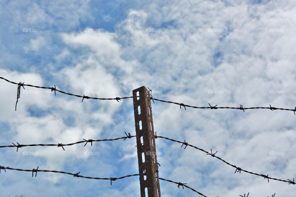 Low angle view of barbed wire