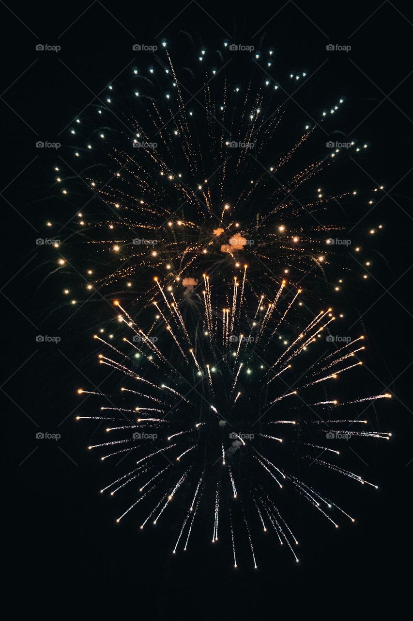 Fireworks explode together.