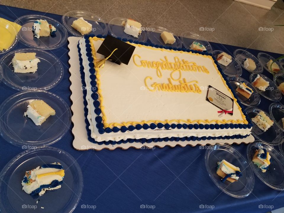 Blue and gold graduation themed cake