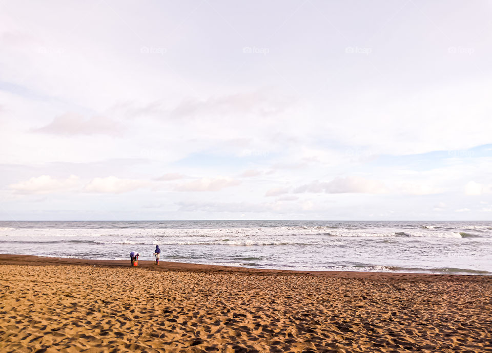 They are stranger and i don't know them. That's little sweet momment. Old couple who are spend holiday. They're looking for some shells and calm. They are really so sweet i think.