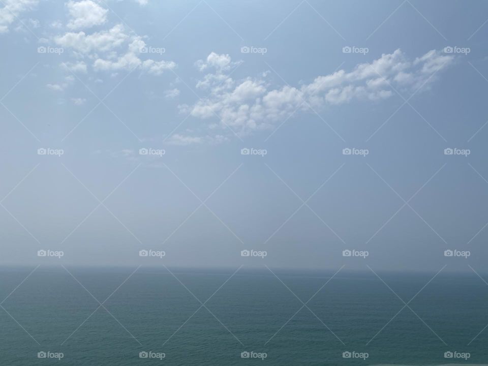 Looking out at the ocean and listening to the waves come in 