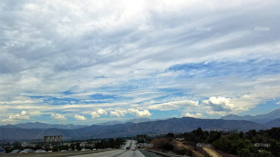 Cloud filled sky. Driving home toward the foothills under a cloud filled sky.
