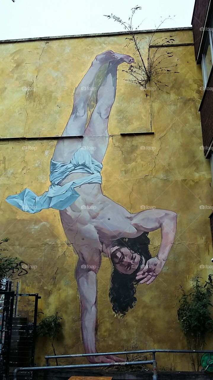 Ancient Man in Robe Upside Down